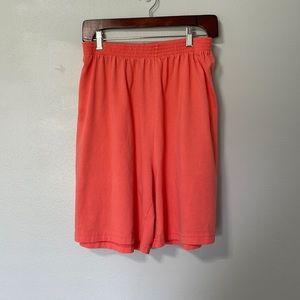 Long, coral colored shorts